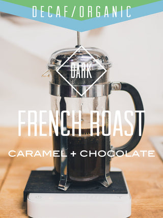 French press brews decaf organic coffee on a scale showing a dark roast with caramel and chocolate notes