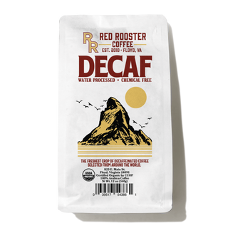 Decaf coffee bag with bold DECAF lettering and mountain illustration