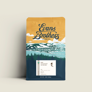 Decaf Vagabond Blend coffee bag in light beige packaging with mountain illustration