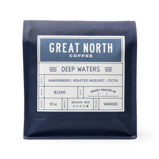 Deep Waters bag from Great North Coffee in navy packaging with the Deep Waters label and marionberry roasted hazelnut cocoa notes