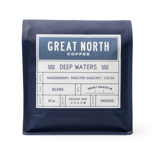 Deep Waters bag from Great North Coffee in navy packaging with the Deep Waters label and marionberry roasted hazelnut cocoa notes