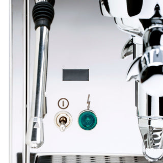 Detail of the chrome front with gauges ports and a green push button on the ECM Mechanika Slim PID espresso machine