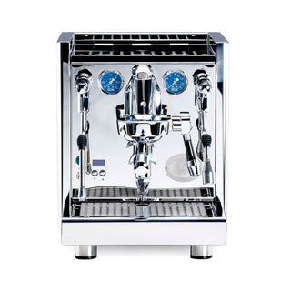 Front view of chrome ECM Technika VI espresso machine with two blue pressure gauges and polished controls
