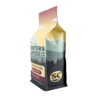 Espresso Blend bag from Sisters Coffee Co with pastel mountain sunset artwork and medium roast label