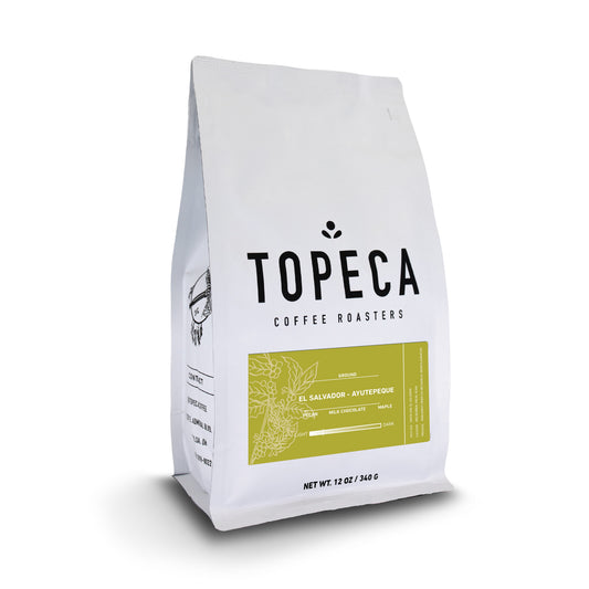 Topeca coffee bag from Ayutepeque El Salvador with white packaging and a gold tasting notes panel