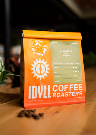 Orange Ethiopia Guji Gogogu coffee bag with green origin label.