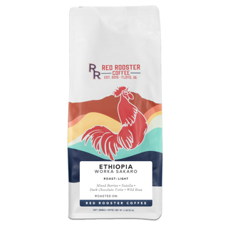 Tall white coffee bag with a colorful rooster graphic and ETHIOPIA WORKA SAKARO label.