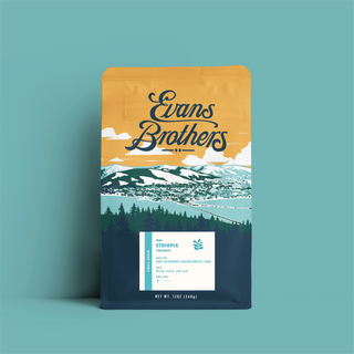 Ethiopia Wuri Yirgacheffe coffee bag by Evans Brothers with mountains artwork on yellow packaging against a teal background