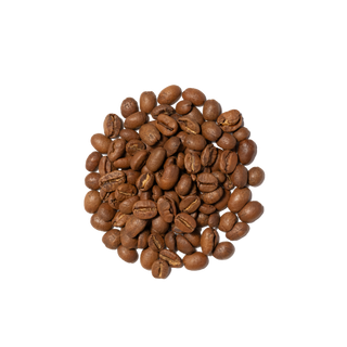 Close up of roasted coffee beans spilled beside a white bag labeled Farmhouse Breakfast Blend