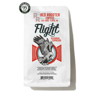 Flight Seasonal Espresso bag with bold Flight branding and a colorful rooster illustration plus a Coffee Review badge.