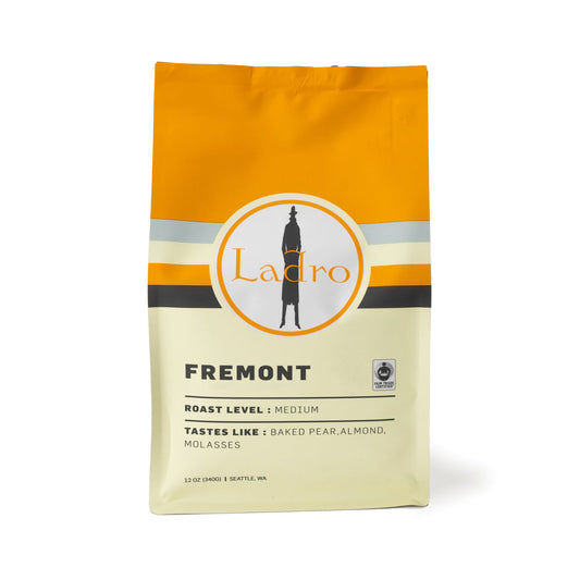 Fremont coffee bag with bold orange top and cream label featuring the Ladro logo and roast level medium