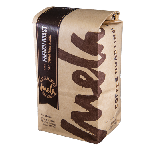 French Roast coffee bag with dark label and kraft wrap, featuring bold vertical French Roast text.