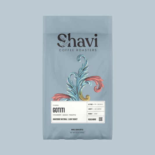 Front view of Ethiopia Gotiti coffee bag featuring the Shavi Coffee Roasters logo on a soft blue background.