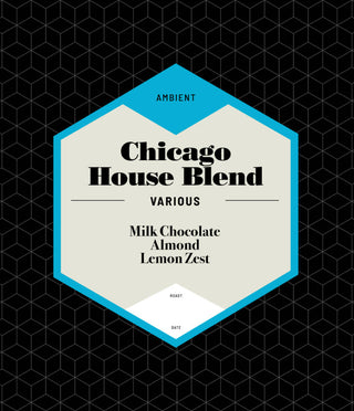 Chicago House Blend coffee label with beige hexagon and blue border on a black geometric background, noting milk chocolate almond lemon zest.