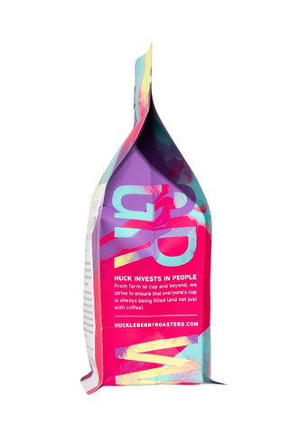 Skeleton Key Decaf bag shown from a slightly different angle with vibrant multicolor artwork.