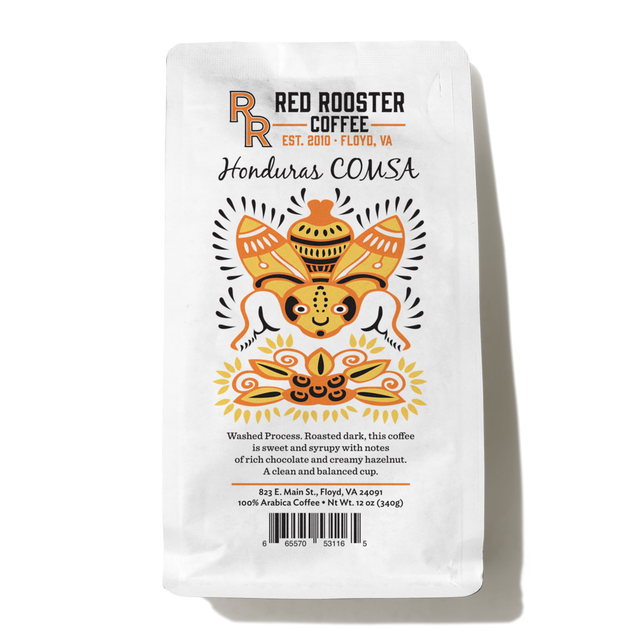 Honduras COMSA Marcala coffee bag with bold colorful motif and COMSA branding on a white package
