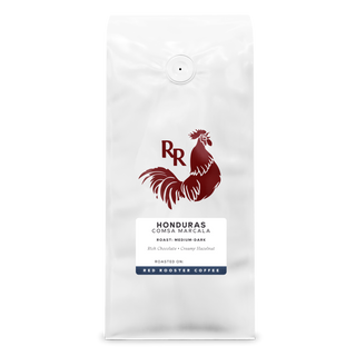 White coffee bag with Red Rooster logo and Honduras COMSA Marcala label on the front