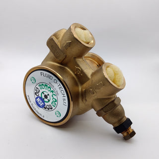 Brass Quick Mill rotary pump with hose fitting and a large circular label on the side.