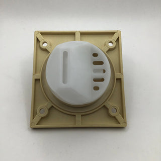 Rear view of the reservoir outlet mounting on a beige base for the Lucca M58 V2 espresso machine