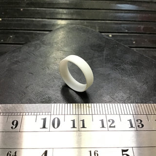 Replacement gasket for La Spaziale steam arm ball joint on a dark work surface