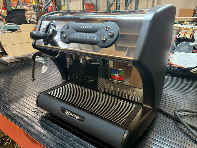 LUCCA A53 Mini espresso machine with portafilter attached and chrome exterior