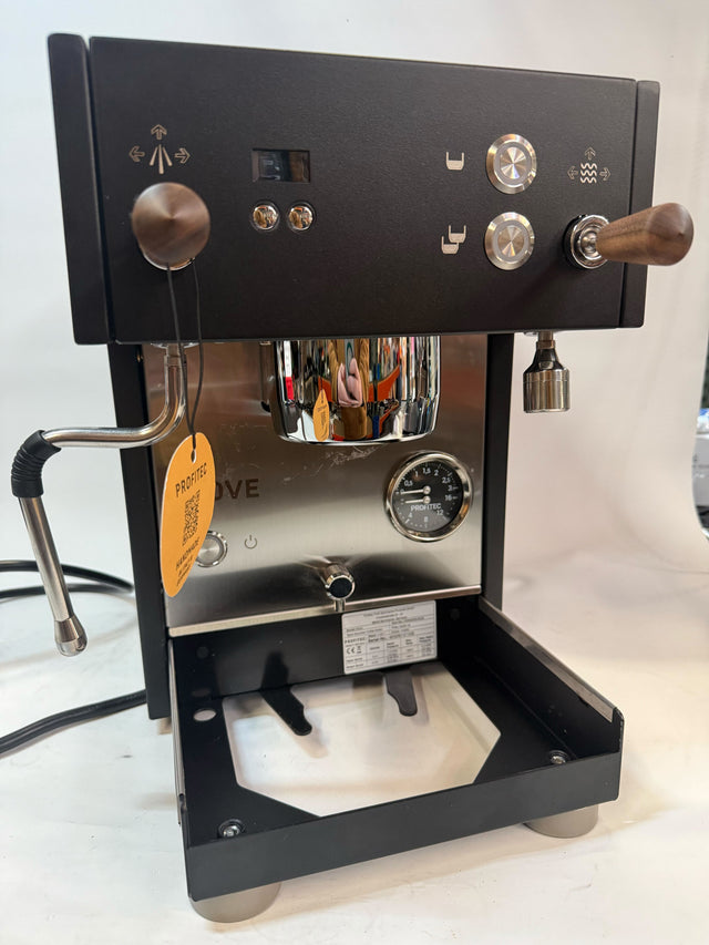 Front panel of Profitec MOVE espresso machine with wood handle porta filter, knobs and gauge