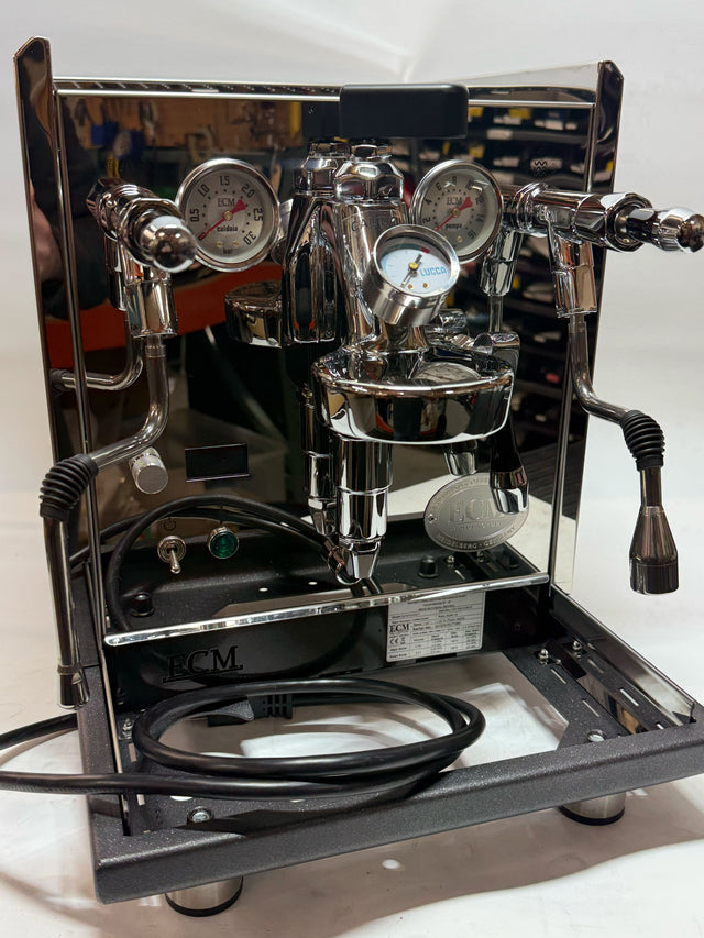 Open Box ECM Synchronika II W FC espresso machine front view with chrome finish and built in gauges.