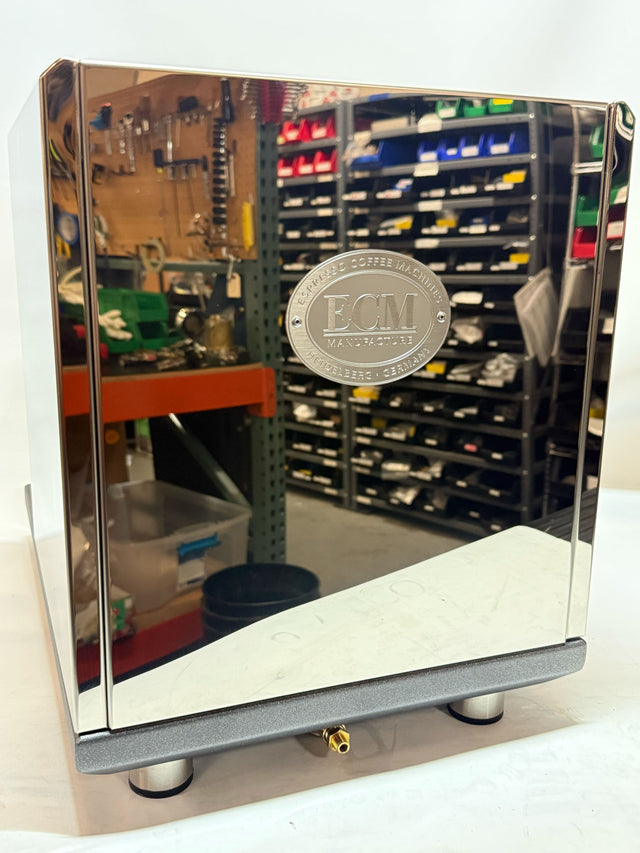 Open box ECM Synchronika II with FC front door featuring a round ECM emblem and polished chrome frame.