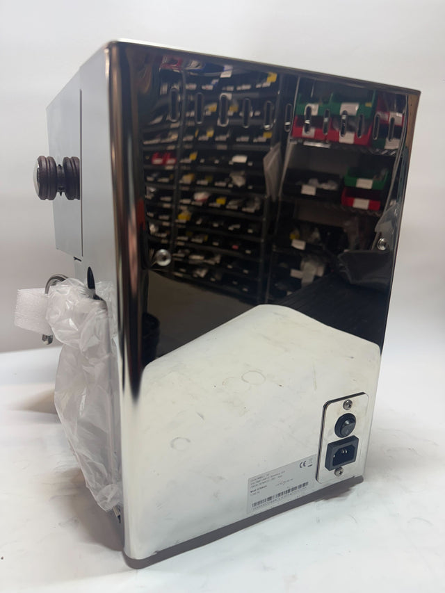 Open box Lucca Tempo espresso machine side view showing back panel and internal components