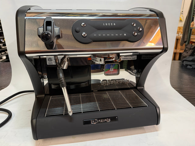Open box Lucca A53 Mini espresso machine with chrome top and included accessories