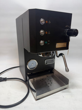 Profitec GO espresso machine front with three controls, gauge, and portafilter on the right
