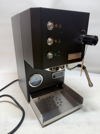 Profitec GO espresso machine front panel with two control knobs, steam wand on the right, and metal drip tray