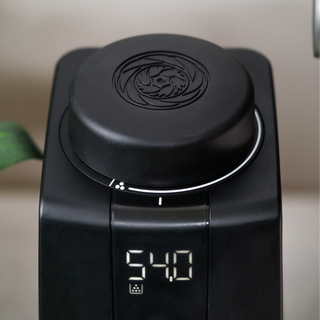 Baratza Encore ESP Pro grinder close up with circular dial and digital readout displaying 54.0