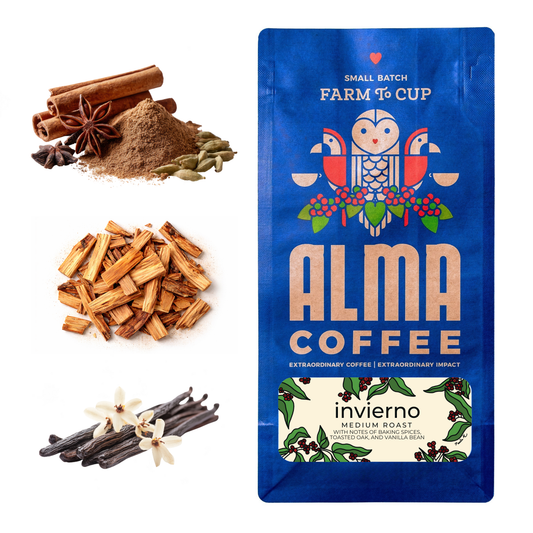 Ground coffee, cinnamon sticks, star anise, and cardamom beside a blue Alma Coffee Invierno bag labeled Farm To Cup.