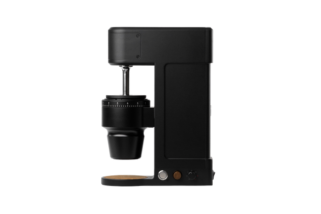 Side profile of The Key compact coffee grinder with conical burr housing and adjustable grind dial