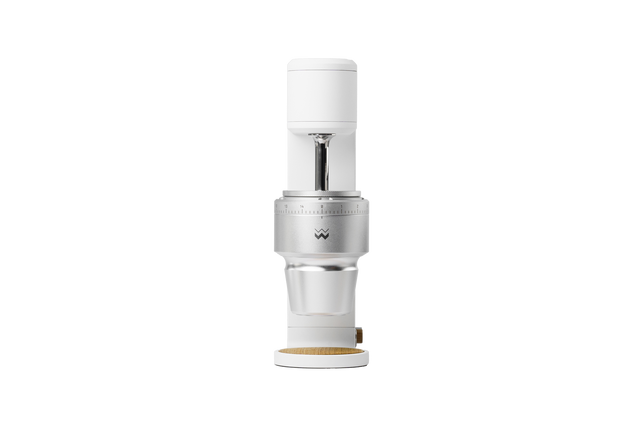 The Key compact coffee grinder head with white top cap and exposed burr housing.