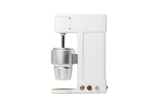 Side view of The Key compact white coffee grinder with exposed burr assembly and calibration dial.