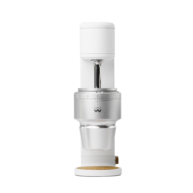 The Key compact white coffee grinder head with exposed conical burr mount and adjustment ring
