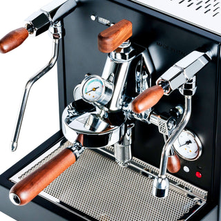 LUCCA E61 espresso machine front panel with wood trimmed handles, chrome levers, and a pressure gauge.