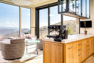 La Marzocco Linea Mini Black Espresso Machine in modern home with mountain overlook