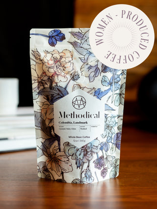 Colombia Landmark coffee bag from Methodical Coffee with floral print and a large round sticker overlay.