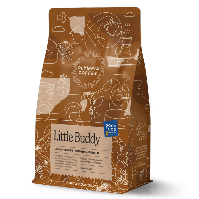 Little Buddy coffee bag by Olympia Coffee Roasting Co with whimsical line drawings and a beige label reading Little Buddy.