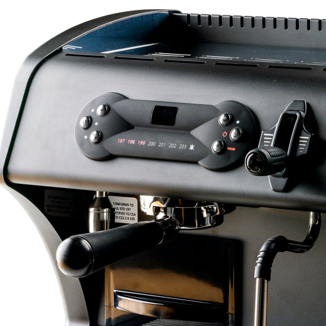 Close up of LUCCA espresso machine control panel with circular gauge and digital display