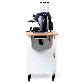 Front view of a compact LUCCA espresso machine mounted on a wooden counter built into a white mobile cart.