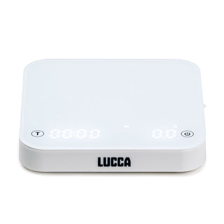 Angled view of LUCCA Precision Scale showing gray weighing surface and the white base with LUCCA logo