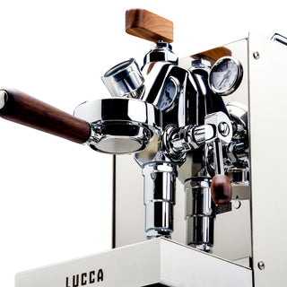 Front view of LUCCA flow control on a stainless espresso machine with wooden handles and gauge visible