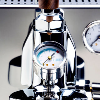 Close up of LUCCA flow control head with wooden knob and dial gauge on chrome espresso machine