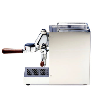 Angled close-up of LUCCA Solo espresso machine highlighting chrome body and wooden portafilter handle.