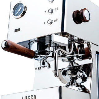 LUCCA Tempo espresso machine front panel with a wood portafilter and chrome control dials