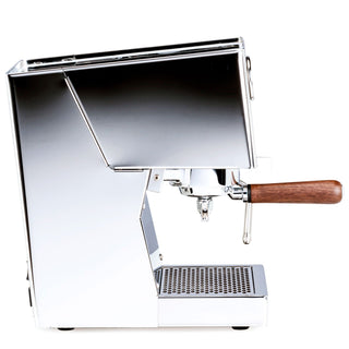 Side view of the LUCCA Tempo espresso machine showing its chrome body and wood portafilter handle